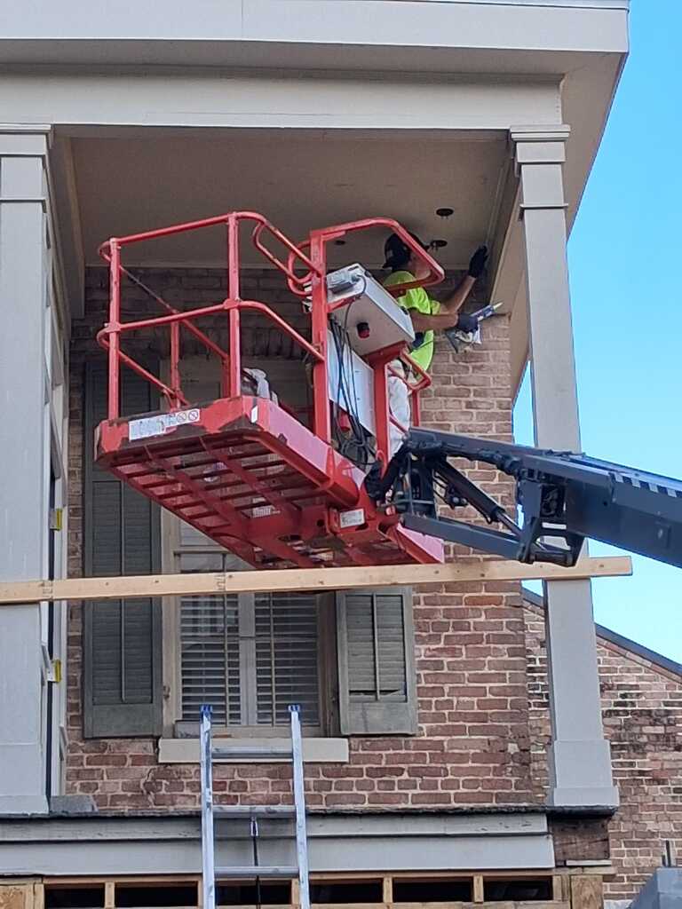 House exterior with cherry picker